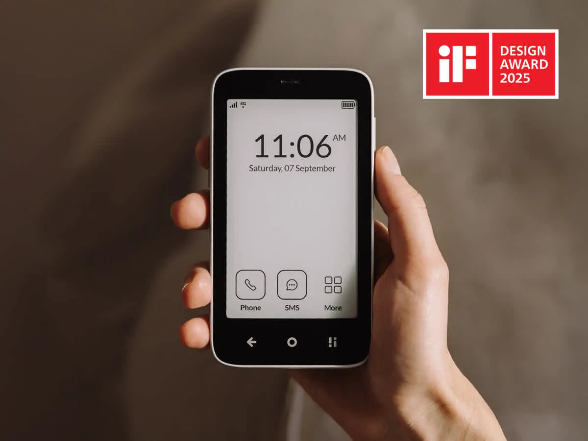 Mudita Kompakt minimalist phone with E-Ink display showing a clean grayscale interface for digital detox